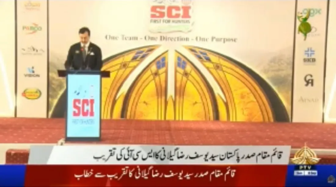 PTV News broadcast still of the Acting President speaking at the gala podium under the SCI backdrop.